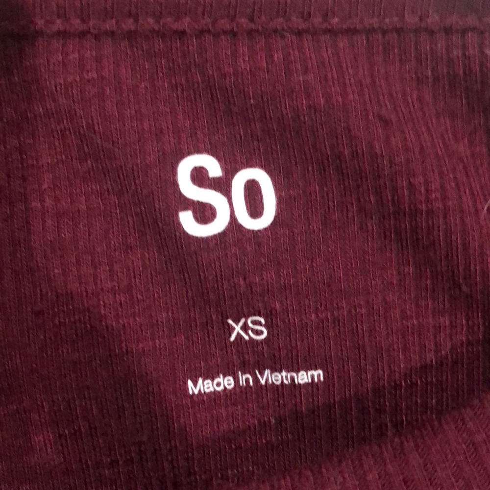 Maroon kids t-shirt with white stripes on sleeves and knot in front